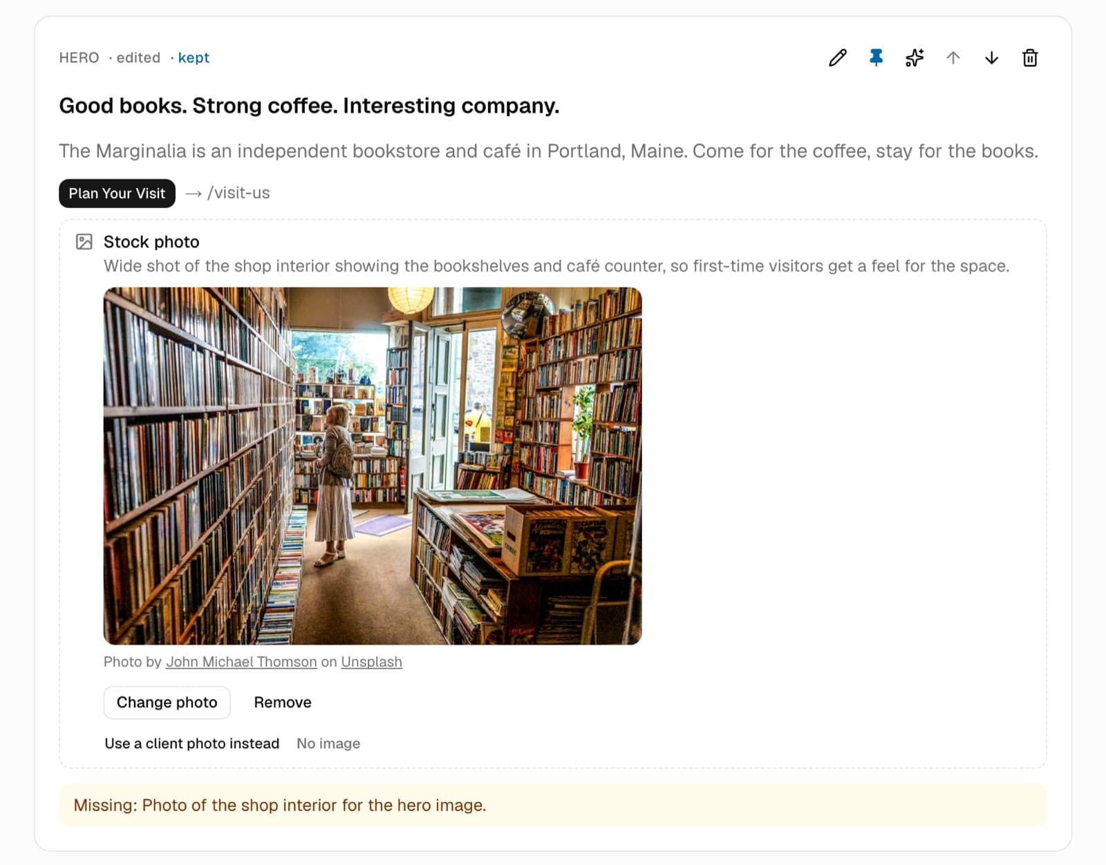 The hero section of The Marginalia's home page in SiteDraft: the headline, intro and Plan Your Visit button, a chosen stock photo with its credit, and a note that a real photo of the shop is still missing.